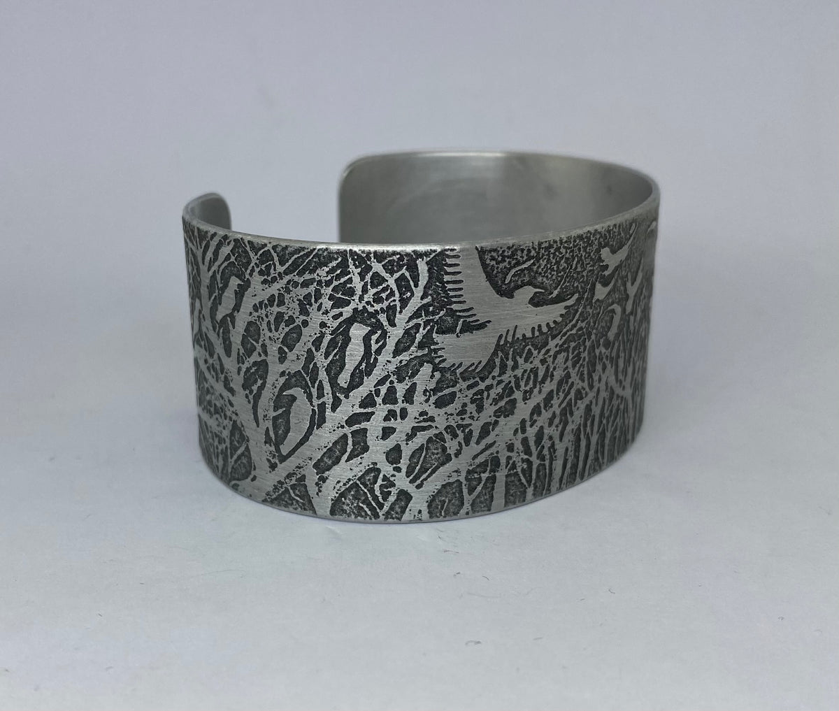 Beautiful aluminium cuff featuring Rooks in a Forest- hand etched by Anna Roebuck from her original illustration.