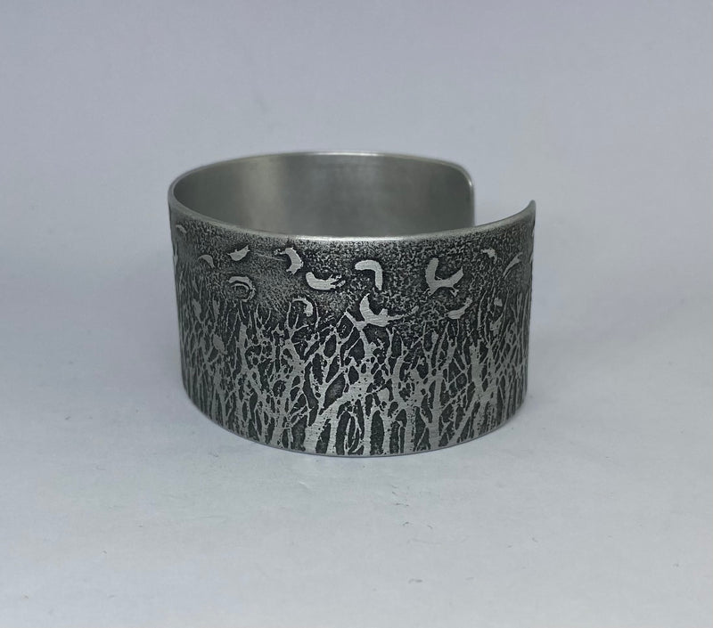 Beautiful aluminium cuff featuring Rooks in a Forest- hand etched by Anna Roebuck from her original illustration.