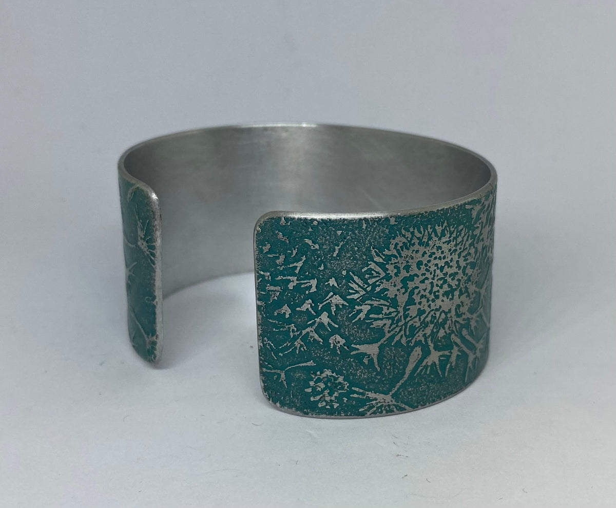 Teal Dandelion aluminium cuff - hand etched by Anna Roebuck from her original illustration.