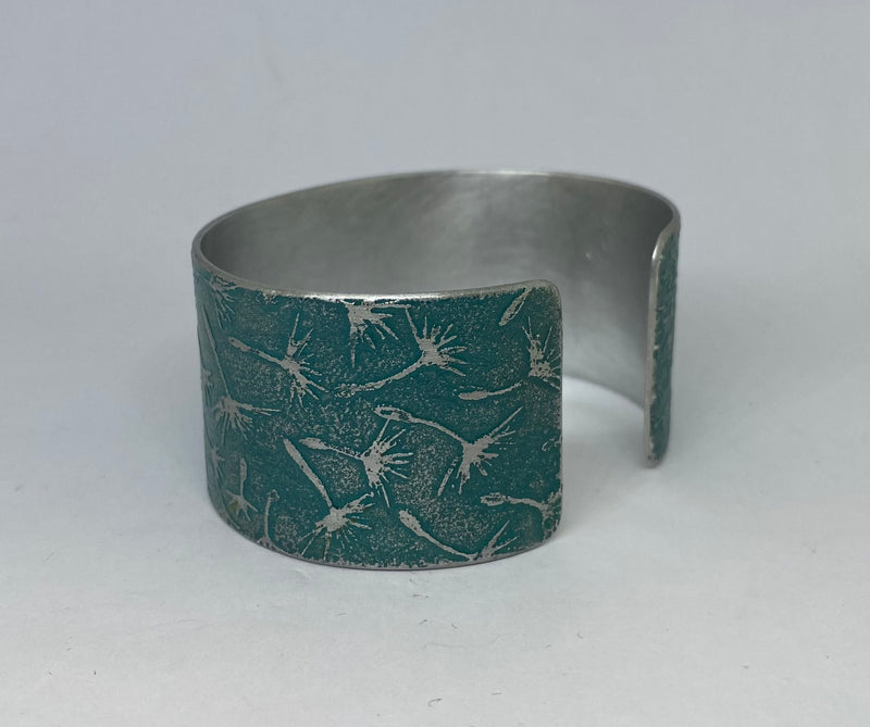 Teal Dandelion aluminium cuff - hand etched by Anna Roebuck from her original illustration.