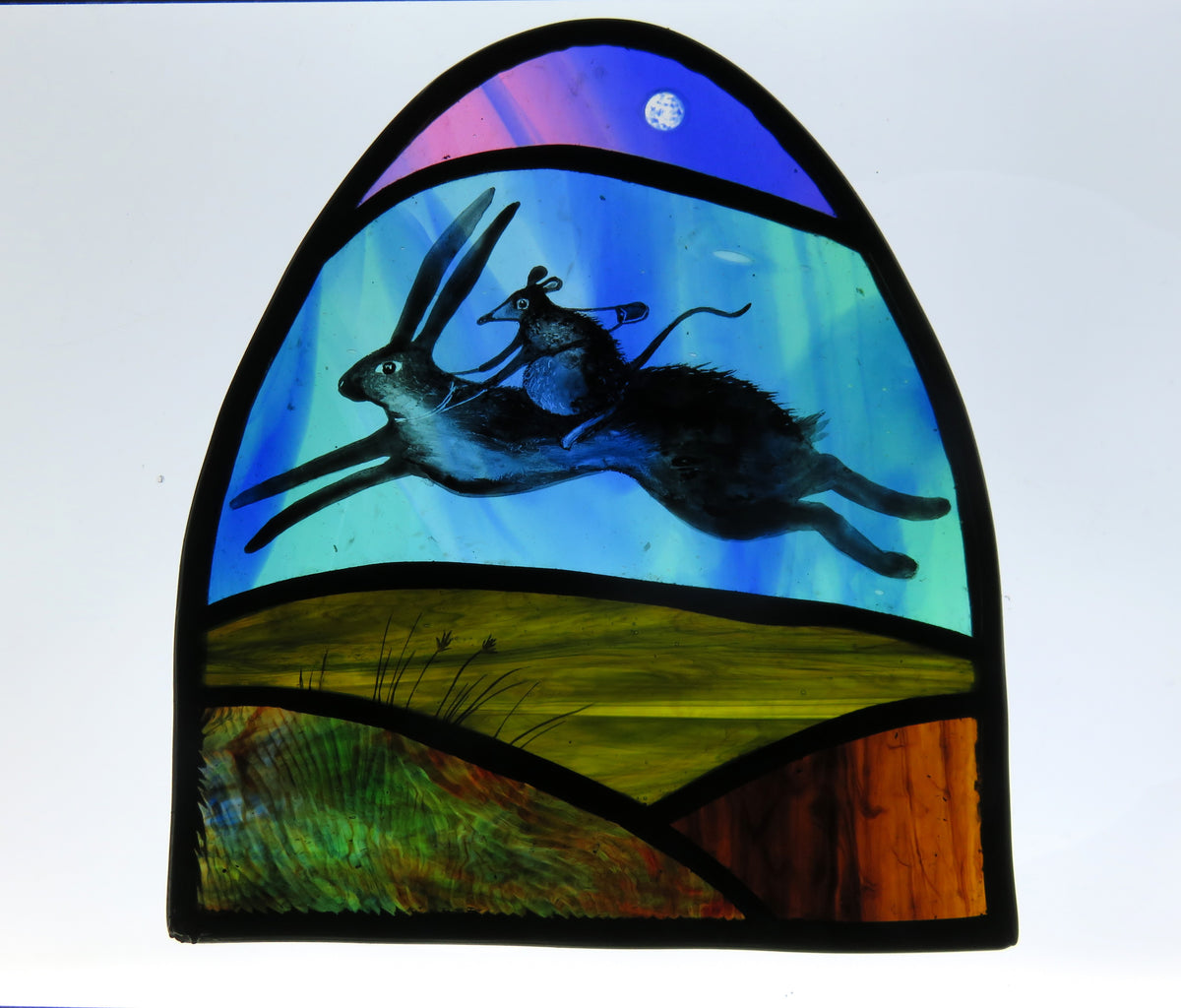 Hare and Shrew Rider - stained glass panel by Debra Eden