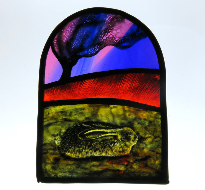 Lying Hare & Tree - stained glass panel by Debra Eden