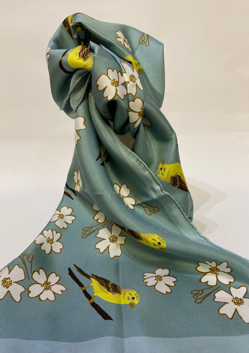 Long, luxurious 100% silk scarf with a yellowhammer bird and flower design by Faye Stevens.