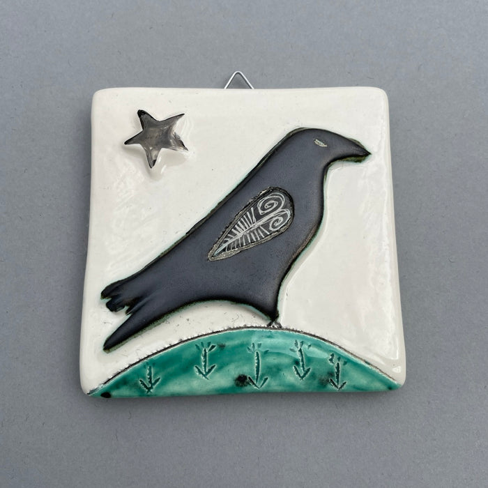 Raven and platinum star hanging tile bu Sophie Smith