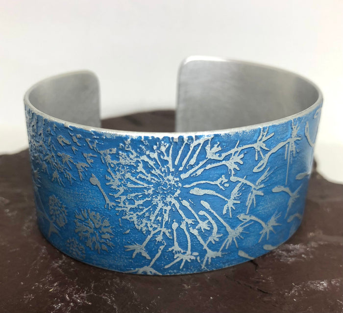 Dandelion Cuff in Etched Aluminium by Anna Roebuck